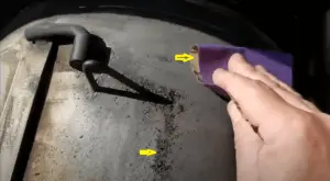 Smoothing rusted area.