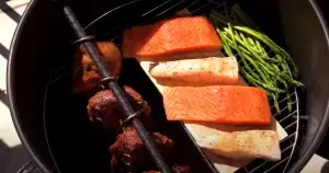 Hinged Grate in the Pit Barrel Cooker