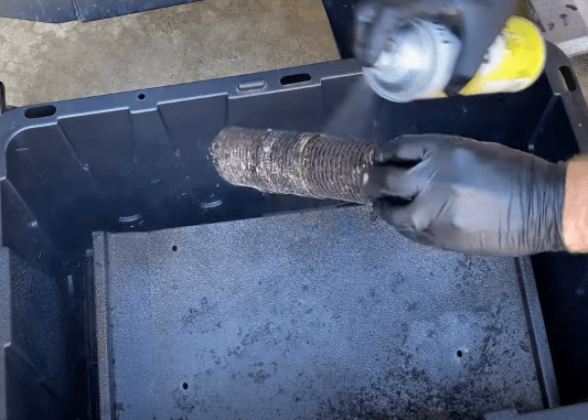 Spray cleaner on smoker tube
