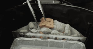 Preparing charcoal grill.
